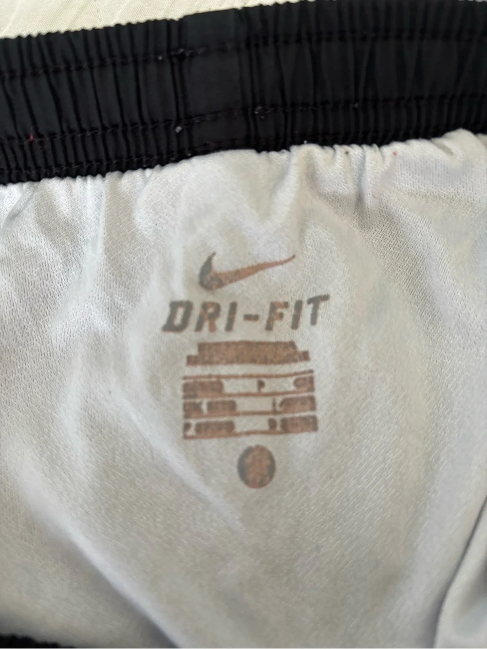 Nike Women’s Black Athletic Shorts with Pink and White Trim